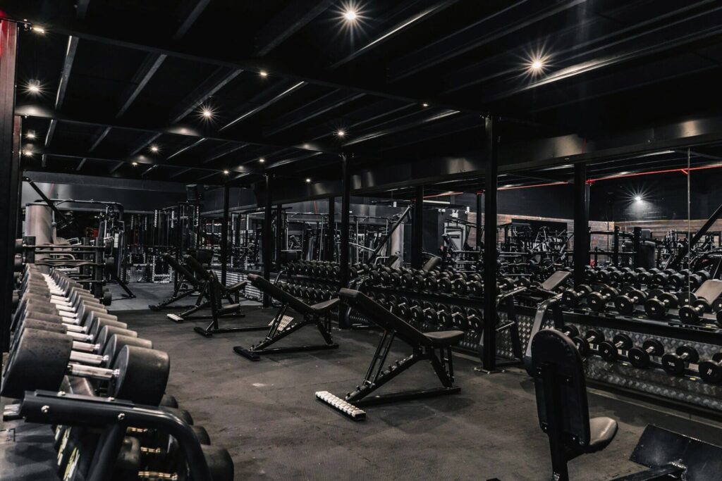 Moody, dark gym space captured during winter, expressing introspection, discipline, and strength.
