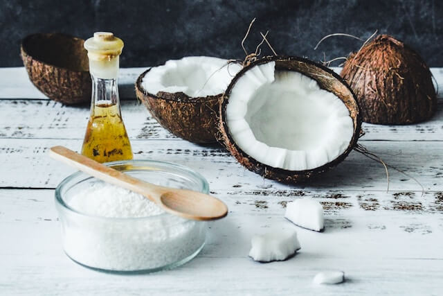 Fresh coconut on a white background, symbolizing natural source of MCT oil.